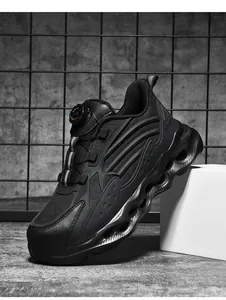 Detail of the quick-dial lacing system and shock-absorbing wavy sole on the safety shoe