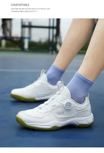 Detail of white and green athletic shoe with breathable mesh and quick dial lacing system