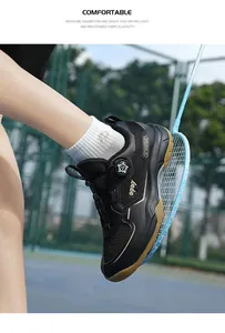Detail of professional badminton shoes with dial lacing system and gum rubber sole