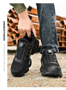 Detail of safety shoe with breathable mesh fabric and rotary knob lacing system