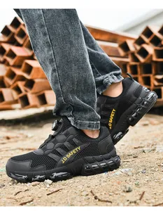 Detail of steel toe safety shoes with rotary buckle closure on industrial construction site