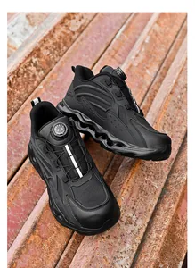 Macro view of industrial safety shoes with breathable mesh and rotating dial lacing system
