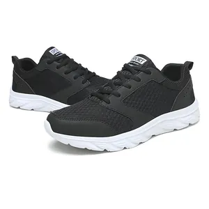 Detail view of breathable black mesh running shoes with white cushioned sport soles
