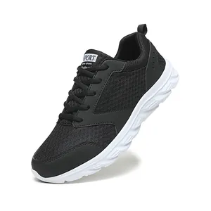 Detail view of breathable black mesh upper and white wavy cushioned sole on men's runner