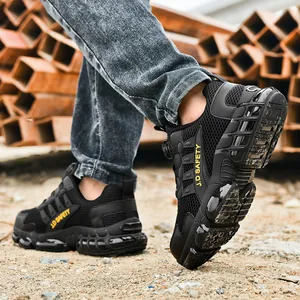 Protective black safety shoes with steel toe and non-slip sole shown in industrial setting