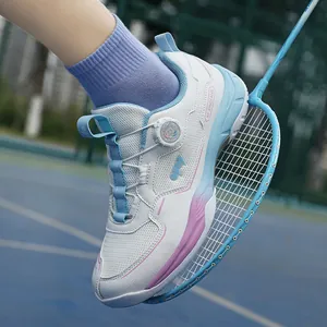 Breathable badminton shoes with BOA dial system and pink gradient on a blue court
