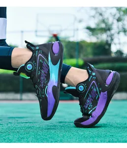 Close-up of professional basketball shoes featuring black mesh and gradient sole detail