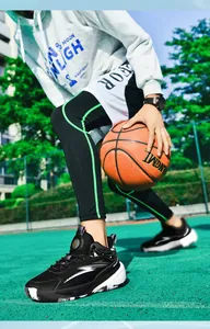 Detail view of the black and white basketball sneakers with shock-absorbing air cushion soles