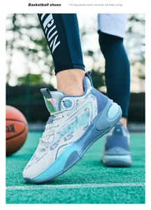 Close-up of high-top basketball shoes with gradient blue cushioning sole on outdoor court