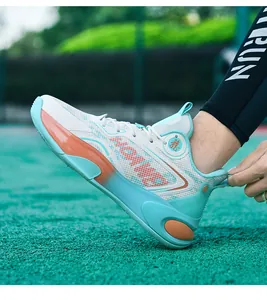 Detailed view of the dragon emblem and gradient side support on basketball shoes