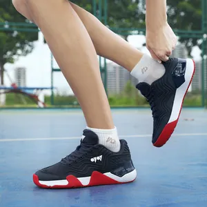 Chaussures de badminton en mesh bleu marine avec semelle dynamique rouge et blanche