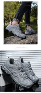 Macro detail of breathable grey hiking shoes featuring rugged non-slip soles and mesh texture