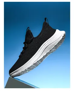 Macro detail of breathable flyknit mesh upper and textured thick sole of black sports shoe