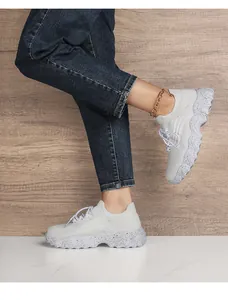 Detailed close-up of light gray breathable mesh walking shoes with textured anti-slip sole