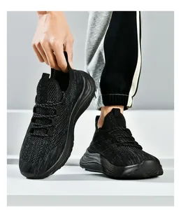 Detailed view of breathable black mesh texture and thick cushioned sole on running shoe