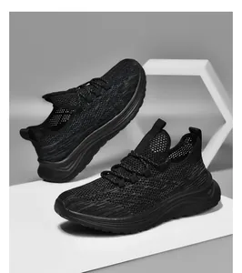 Close-up of black breathable mesh texture and non-slip sole on men's running shoes