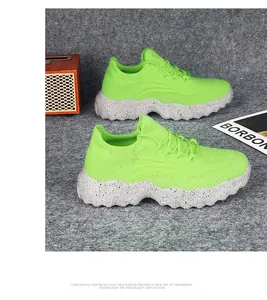 Detailed macro of breathable neon green knit mesh upper and thick marble rubber sole