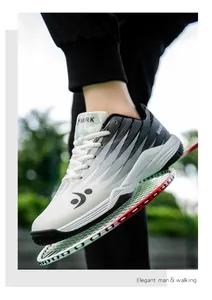 Detail of professional non-slip badminton shoe sole gripping a racket mesh surface