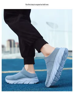 Macro shot of breathable fly-knit mesh fabric and thick cushioned sole of the slip-on shoe