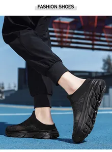 Side view of black breathable mesh slip-on sneakers with anti-slip thick rubber soles