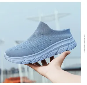 Detail of light blue knitted slip-on mule sneaker with thick EVA cushioning sole