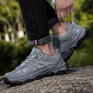 Grey outdoor hiking shoes with breathable mesh and rugged rubber sole for men and women