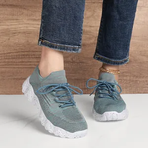 Breathable grey-blue knitted walking shoes with cushioned white speckled wavy outsoles