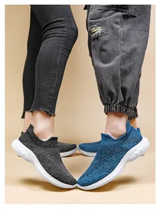 Detail of breathable knit mesh upper and thick white sole on casual slip-on walking shoes
