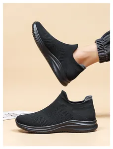 Detail of black breathable mesh slip-on sneakers with anti-slip thick rubber sole
