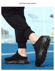 Close-up of black breathable mesh slip-on sneaker with anti-slip sole on blue court