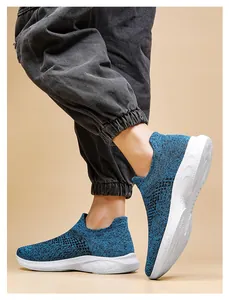 Detail view of the breathable navy knit fabric and flexible slip-on sock shoe design
