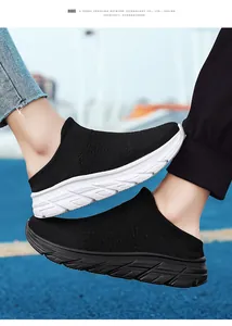 Detail of breathable fly-knit mesh mules with lightweight EVA sole on running track