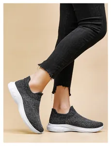 Detail of breathable knit slip-on sneaker with thick cushioning sole for women