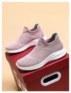 Detailed macro view of pink breathable knit mesh and flexible thick white wavy soles