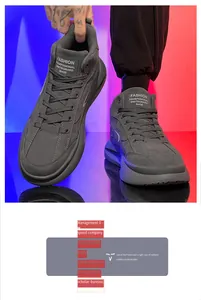 Dettaglio delle sneakers mid-top grigio scuro da uomo con etichetta sulla linguetta
