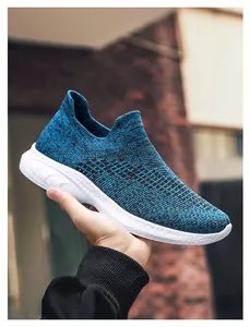 Detail showing the lightweight blue knit fabric and flexible sole of this slip-on sneaker