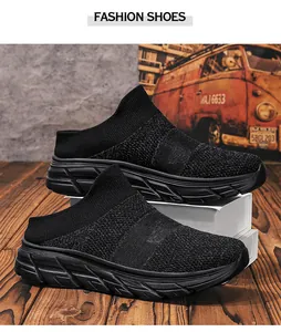 Detailed view of black breathable mesh sock sneakers with chunky anti-slip rubber soles