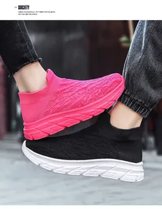 Detail view of breathable knit sock sneakers in rose red and black with thick soles