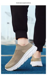 Detail of khaki breathable slip-on mesh sneakers with thick white sole on blue court