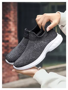 Close-up of lightweight grey fly-knit walking shoe showing breathable mesh texture