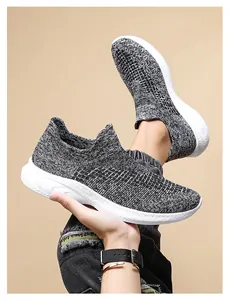 Detail shot of breathable knit fabric and lightweight non-slip sole of casual sneakers