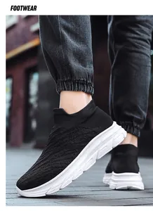 Detail of black knit walking shoe with breathable mesh and white thick non-slip sole