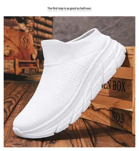 Close-up of white breathable fly-knit slip-on sneaker on vintage wooden floor background