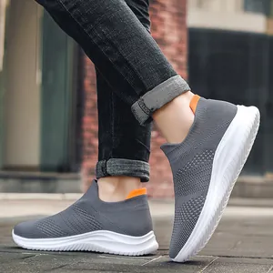 Men's grey knit slip-on sneaker with breathable mesh and orange heel pull tab
