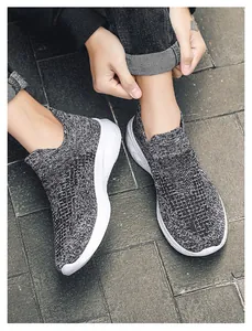 Breathable knit walking shoe detail showing textured grey fabric and cushioned white sole