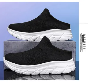Detail view of breathable black knit mule sneaker with thick white cushioned sole for comfort