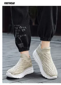 Close-up of khaki breathable knitted mesh fabric on men's lightweight walking shoes
