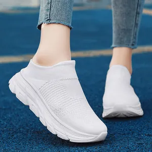 White breathable knit slip-on sneakers for women and men with non-slip rubber soles