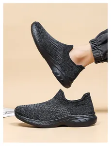 Detail showing breathable black knit mesh texture and flexible elastic slip-on cuff of the shoe