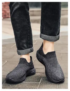 Detail of breathable knit slip-on sneakers with cushioned sole on an outdoor surface